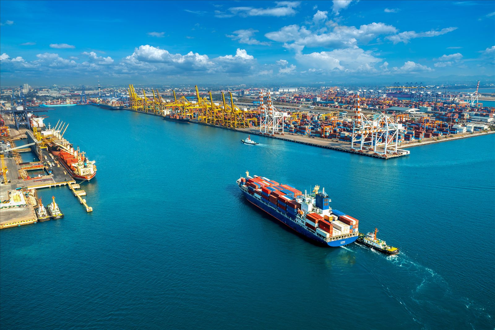 Container ship loaded with vehicles departing a US port